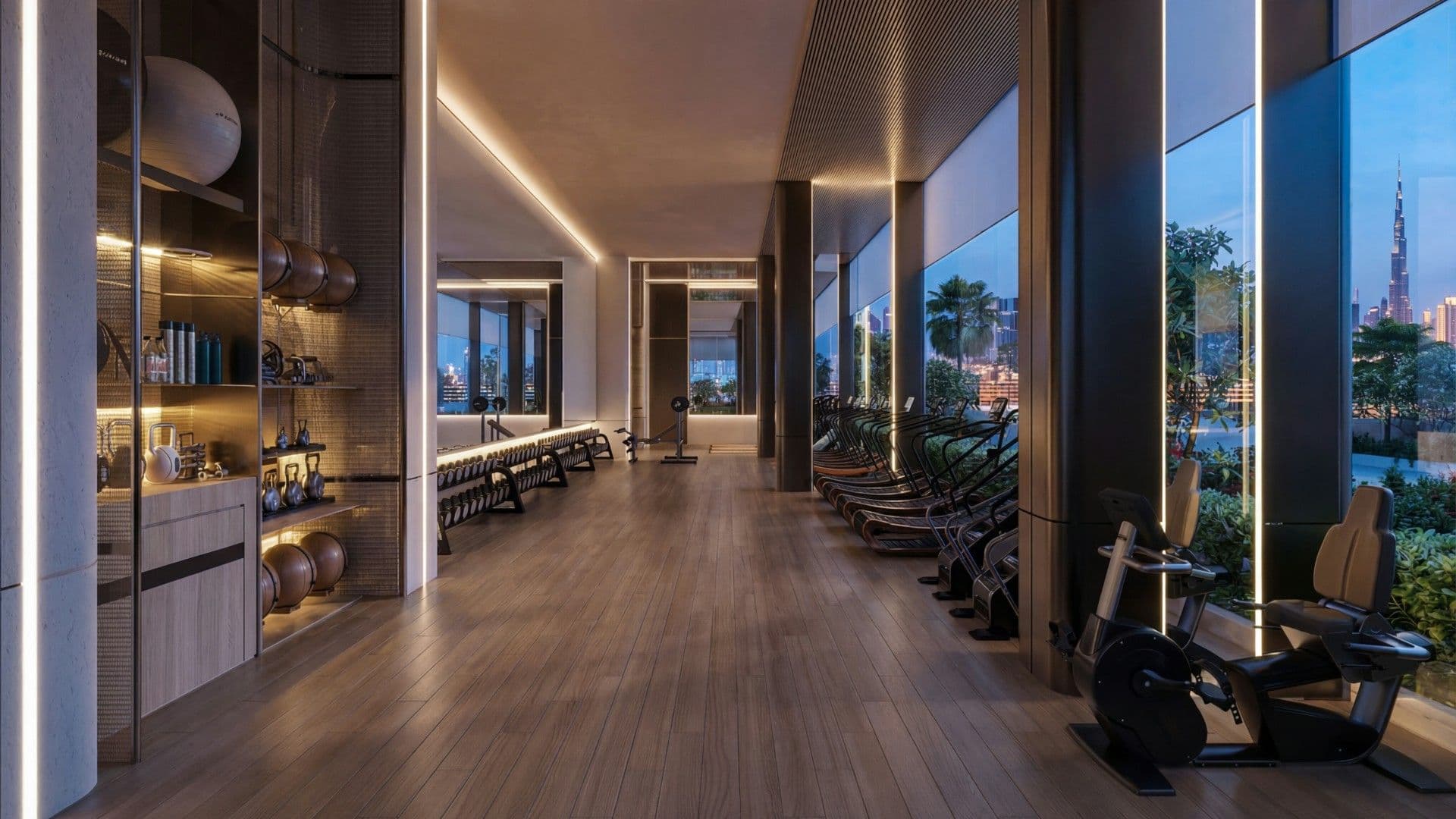 Indoor gym with skyline views at Binghatti Luxuria